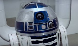 Star Wars R2-D2 standing in a hallway