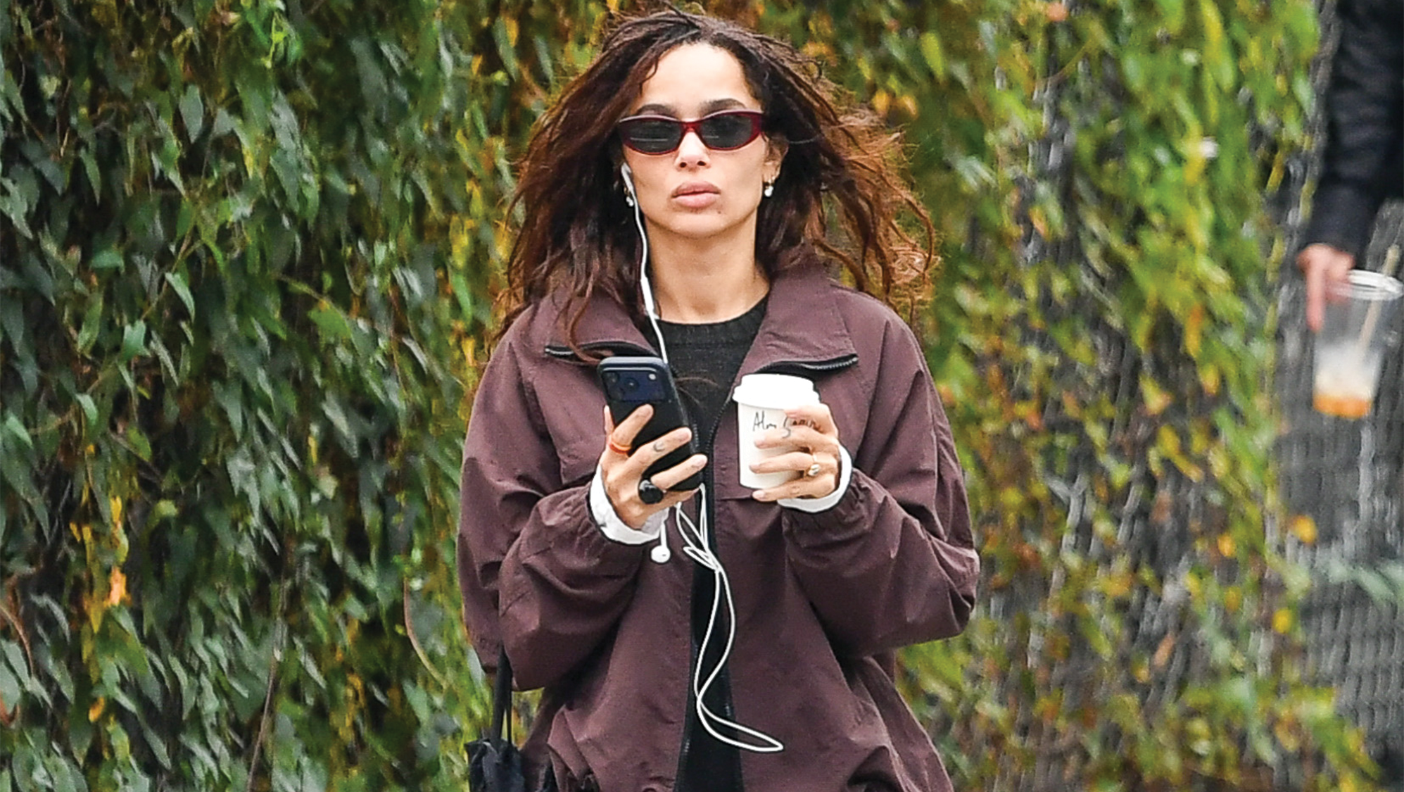 Zoe Kravitz wore a dark brown jacket over black top, black trousers and brown ballet flats. Harry wore a brown jacket with black trousers, burgundy ballet flats and a large Chanel bag.