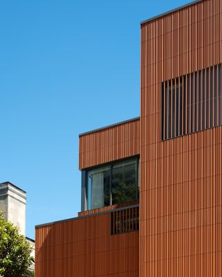 Terracotta façade of Victorian townhouse reimagined as the Meeting and Guest House of Pennsylvania University, by Deborah Berke Partners