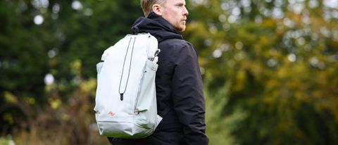 Peak Design Outdoor Backpack 25L on a man&#039;s shoulders outdoors