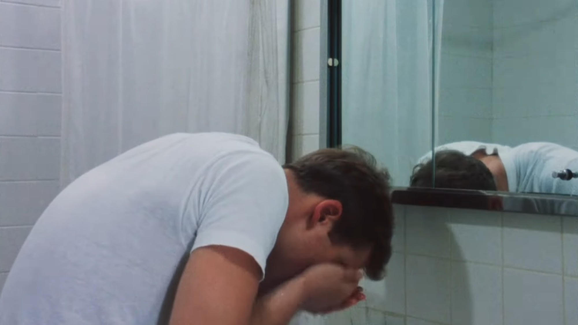 Peter Bernuth washing his face in The Big Shave