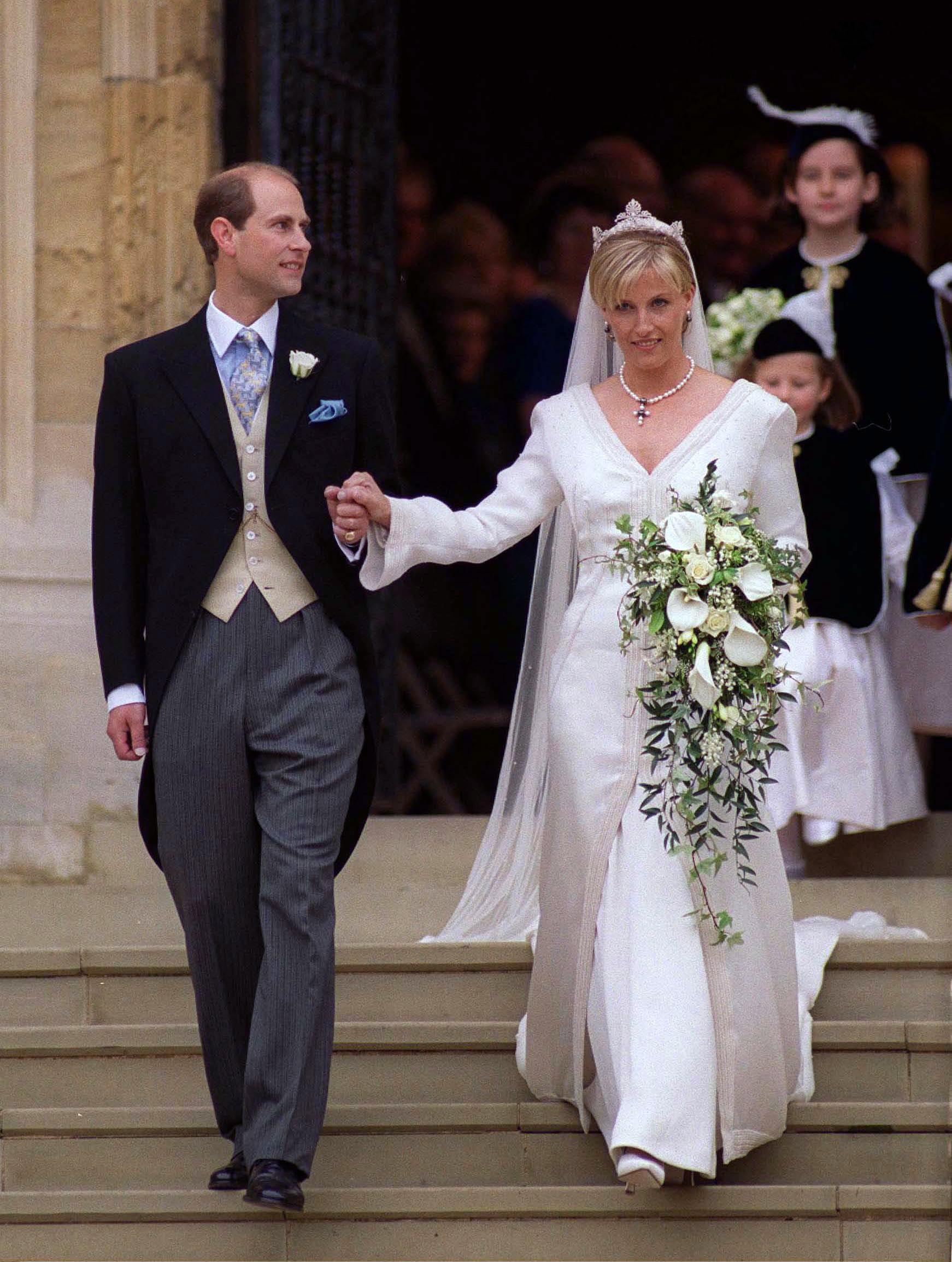Prince Edward and Duchess Sophie on their wedding day walking out of church