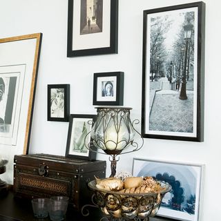 white wall with picture on wall and lamp