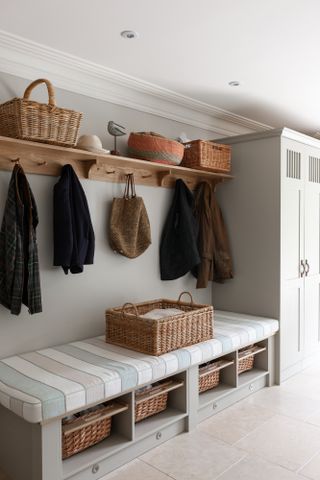 hallway storage or bootroom storage solution with comfy bench, coat hooks and storage cupboard custom built by mowlem & co
