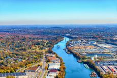 The Cumberland River in Tennessee with buildings along its banks.