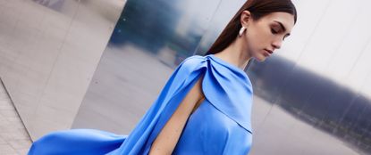 Model wearing blue Karen Millen dress