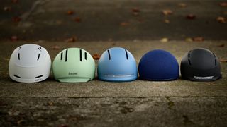 group image of commuter bike helmets in an urban environment