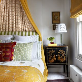A brightly patterned canopy bed