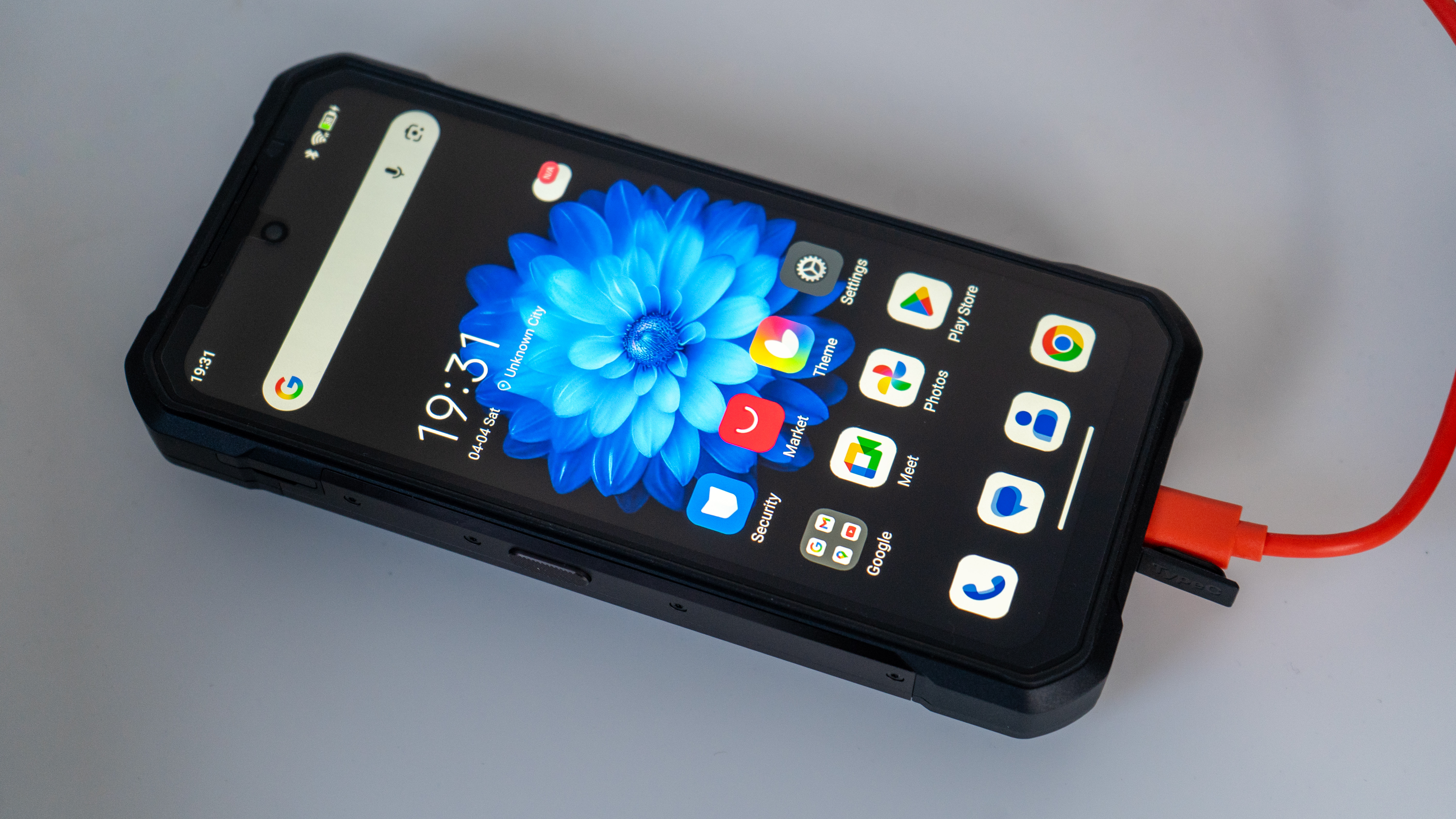 Oukitel WP61 Ultra phone plugged into the supplied charging cable