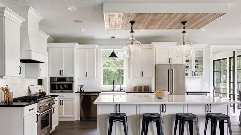 A bright and spacious kitchen with an inverted tray ceiling
