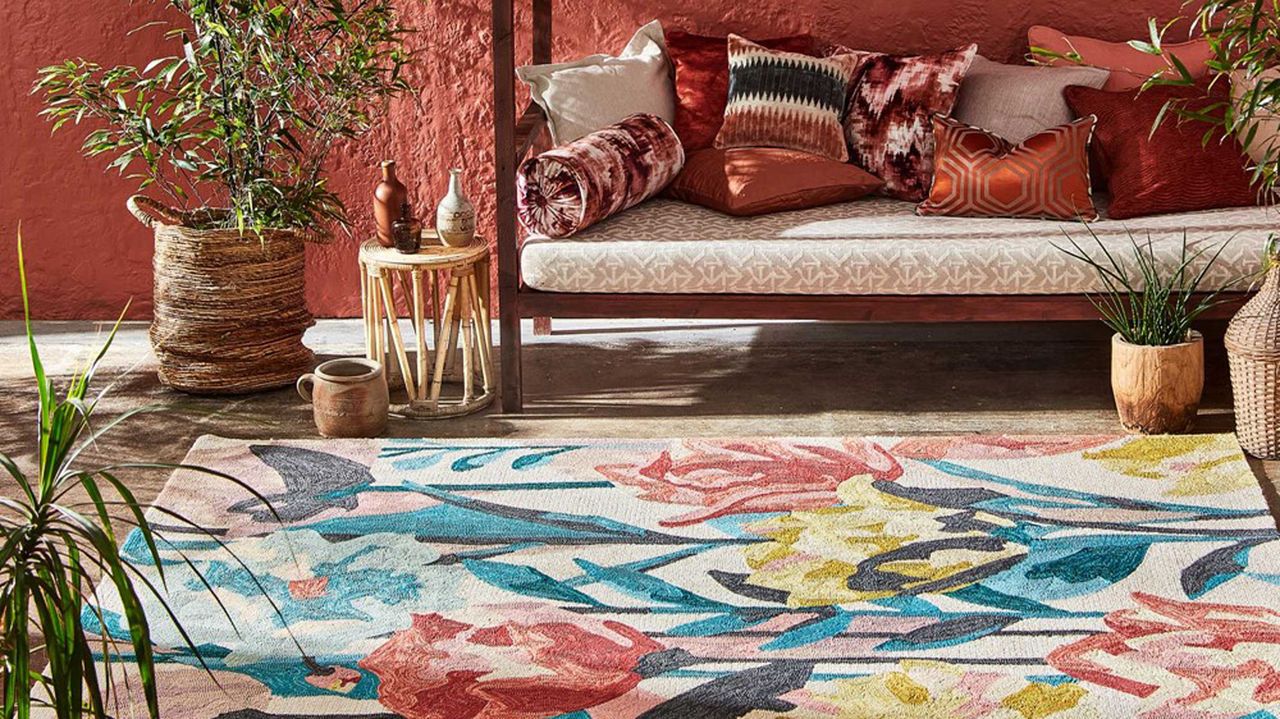 patterned outdoor rug, boho bench with cushions and accessories