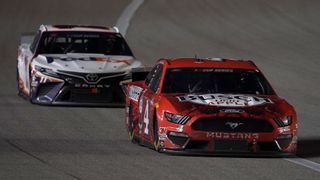 Kevin Harvick leads Denny Hamlin during a July 2020 race at Kansas Speedway, a familiar position for the two top drivers in the Cup Series standings heading into the playoffs.