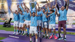 Manchester City celebrate with the Premier League trophy after winning the Premier League at Etihad Stiadum on May 21, 2023