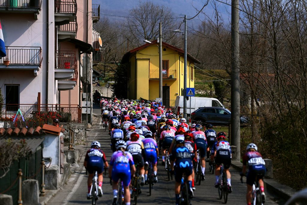 CITTIGLIO ITALY MARCH 20 A general view of the peloton compete through a village during the 46th Trofeo Alfredo BindaComune di Cittiglio 2021 Womens Elite a 1418km one day race from Cocquio Trevisago to Cittiglio TrBinda UCIWWT on March 20 2022 in Cittiglio Italy Photo by Tim de WaeleGetty Images