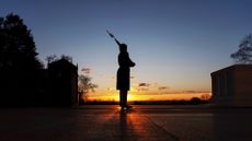 A U.S. Army honor guard stands vigil at the Tomb of the Unknown Soldier in Arlington National Cemetery in Arlington, Virginia
