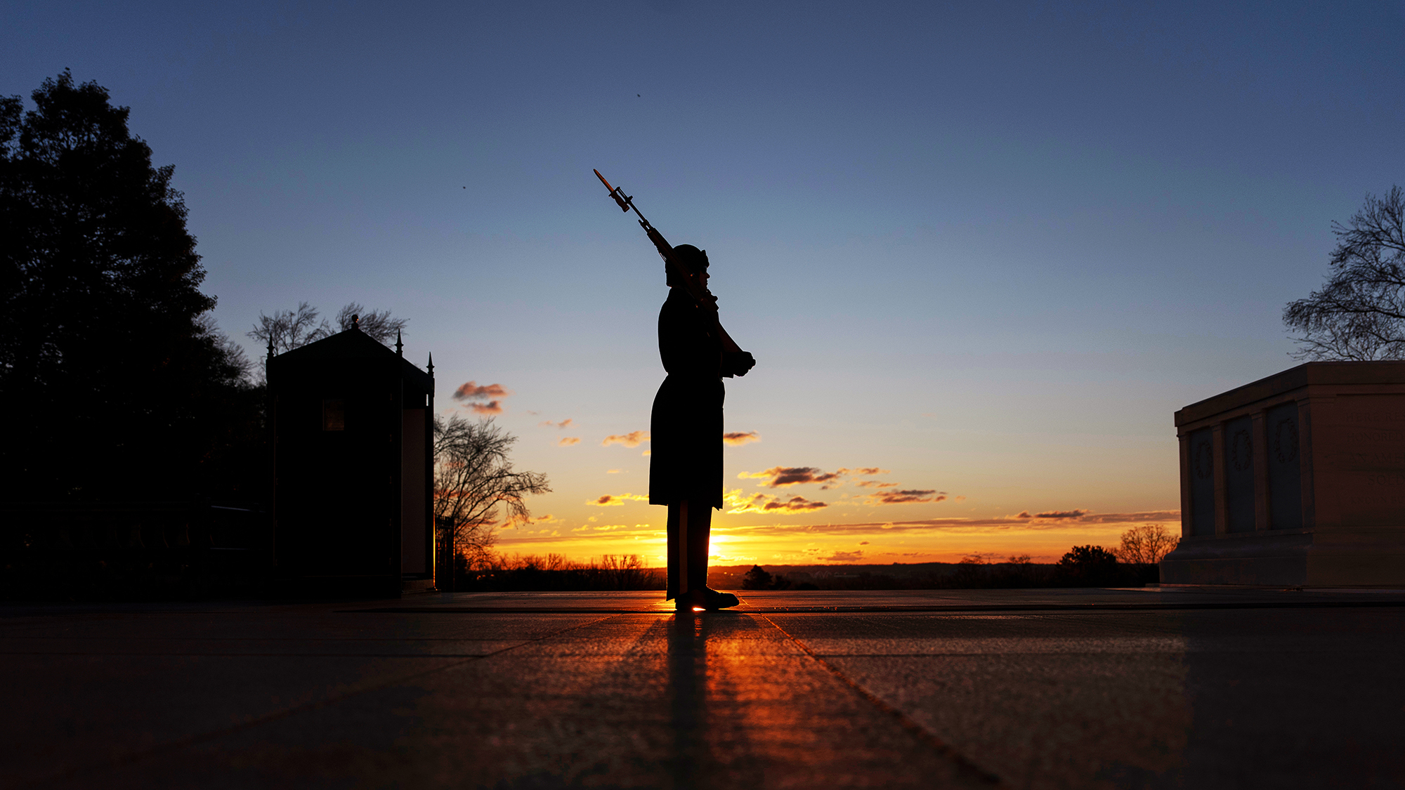 A U.S. Army honor guard stands vigil at the Tomb of the Unknown Soldier in Arlington National Cemetery in Arlington, Virginia