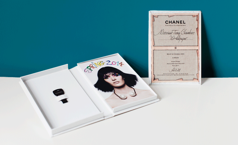  Inside a book-like buckram case, Chanel presented its 'Art…' collection look book on individual cards and a USB key