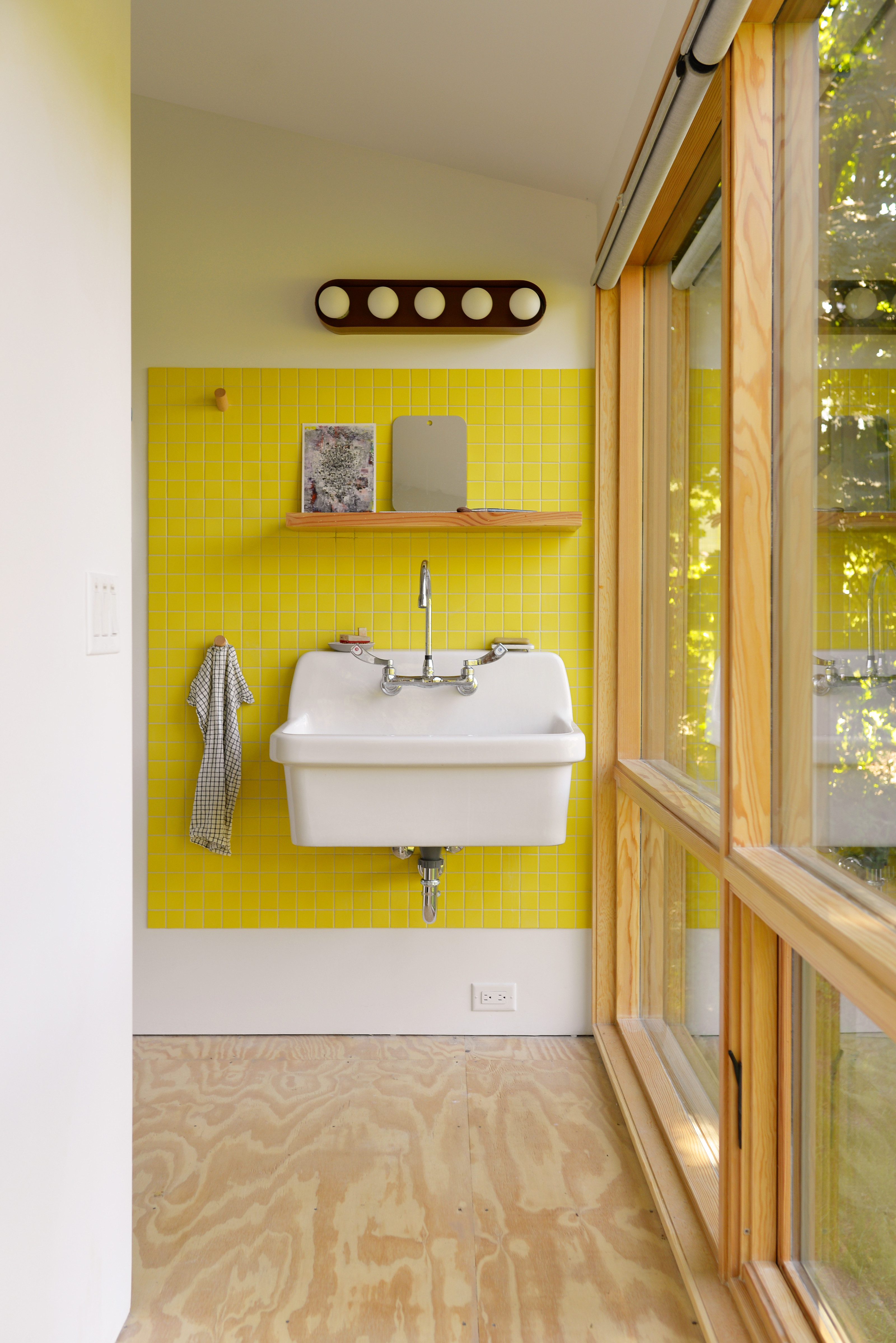 The studio contains a bathroom alongside the office