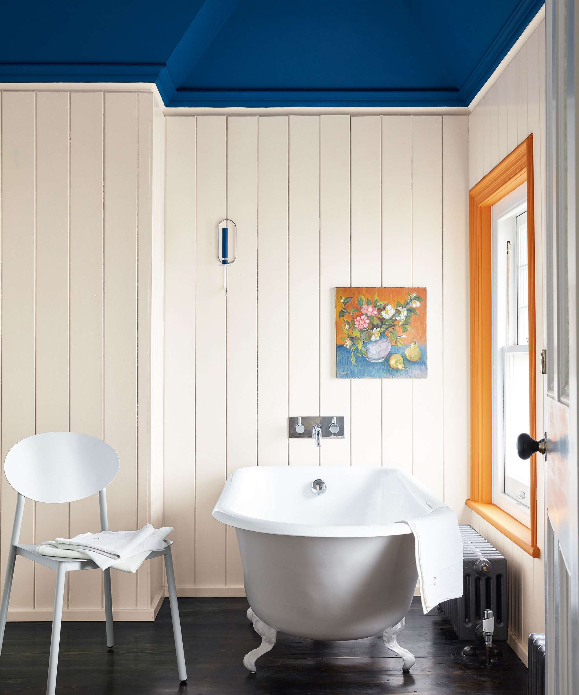 bathroom with white wall panelling and colour capping in blue
