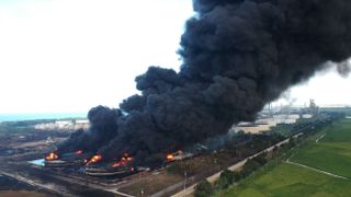 Aerial photo shows thick smoke rises due to fire at Pertamina's oil refinery.