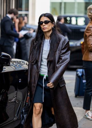 Stylish Londoner wearing a long leather jacket