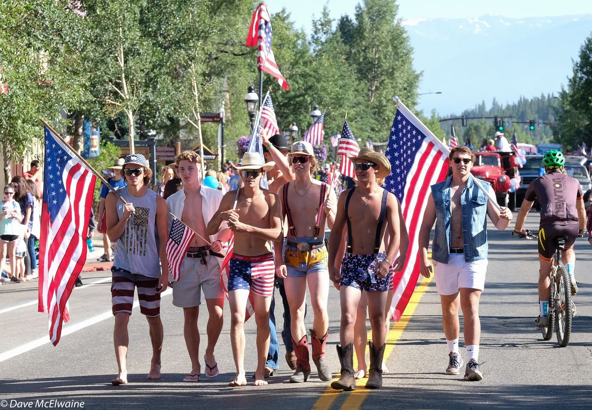 A group of young men with flags preceded the official parade