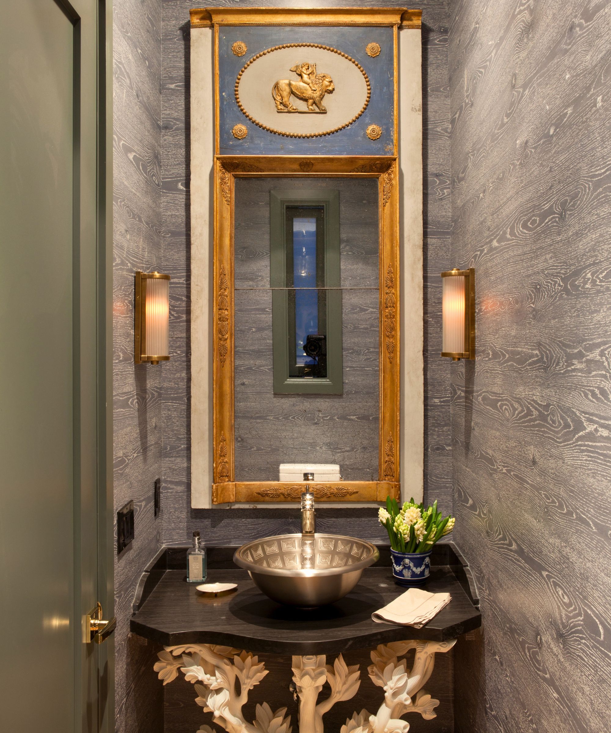 powder room with gold accents, wallpaper and vanity base