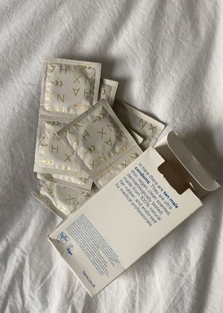 A packet of some of the best condoms from Hanx on a bed