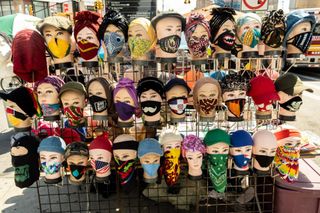 large display of face masks shows an amazing array of designs, East 149th Street at Third Ave, Bronx, NY