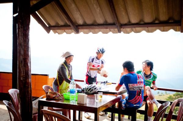 Riders have lunch at a Chinese restrant