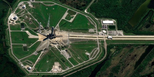 SLS and Orion, stacked at launch pad 39B at NASA's KSC, as seen from space by the Pl&eacute;iades Neo satellite, operated by the European aerospace company Airbus.