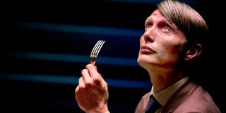 Mads Mikkelsen (Dr. Hannibal Lecter) with fork looking up