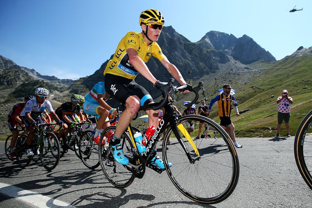 Chris Froome rides among the mountains during stage 11.