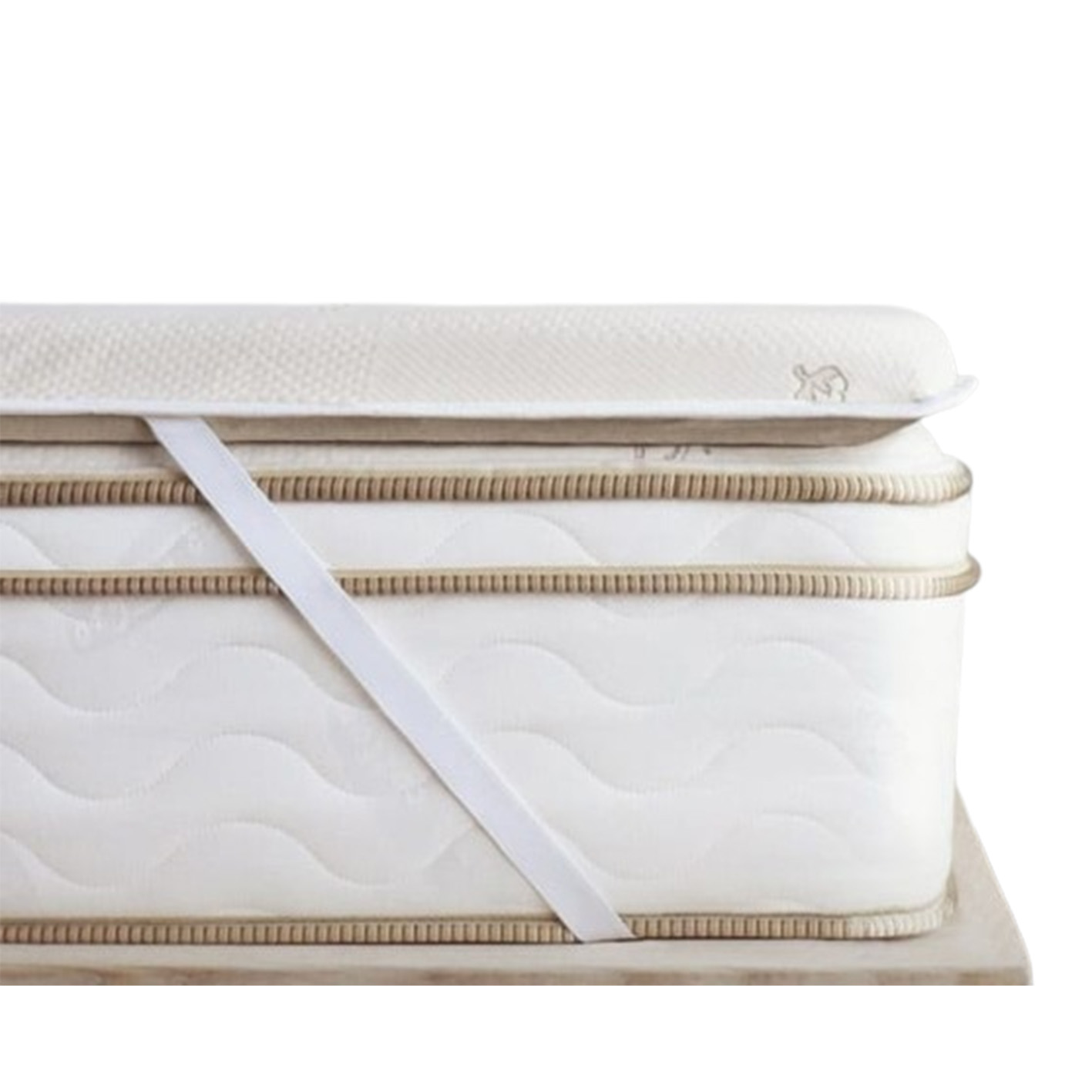 The Saatva Graphite Mattress Topper on a white background.