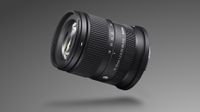 Sigma 18-50mm f/2.8 DC DN | C Canon RF lens against a grey, gradient background