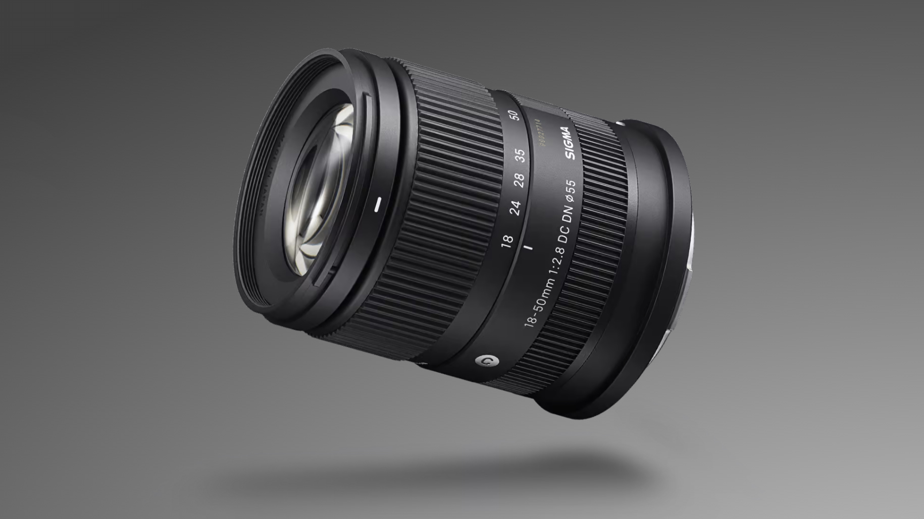 Sigma 18-50mm f/2.8 DC DN | C Canon RF lens against a grey, gradient background