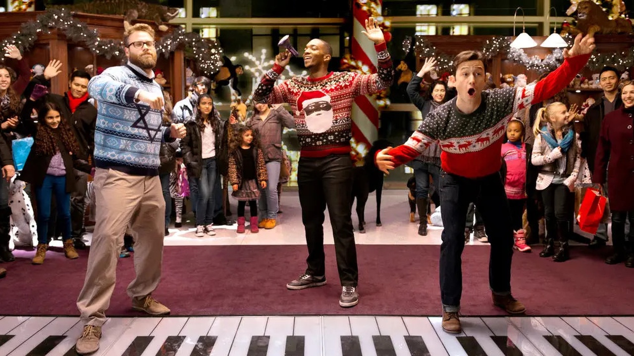 Issac (Seth Rogen), Chris (Anthony Mackie) and Ethan (Jospeh Gordon-Levitt) dance on a giant keyboard in The Night Before