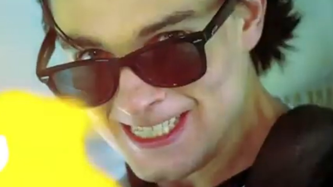 Gregory Smith with lowered sunglasses in Hobo With a Shotgun