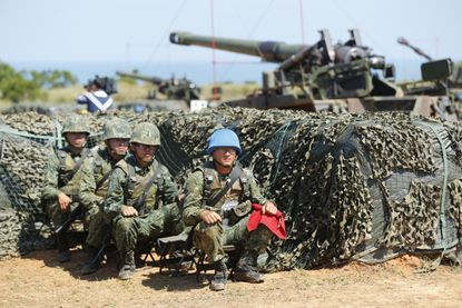 Taiwan's military rest during a drill.
