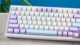 A white and purple Epomaker Ajazz AK820 Pro mechanical keyboard