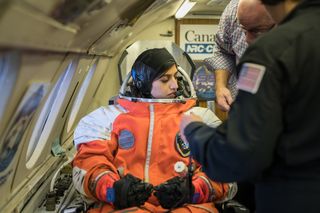 A Final Frontier Design IVA suit being tested by Project PoSSUM on astronaut candidate Shawna Pandya inside a Falcon 20 jet. SpaceX and Boeing have their own spacesuits that their astronauts will wear in upcoming crewed missions.