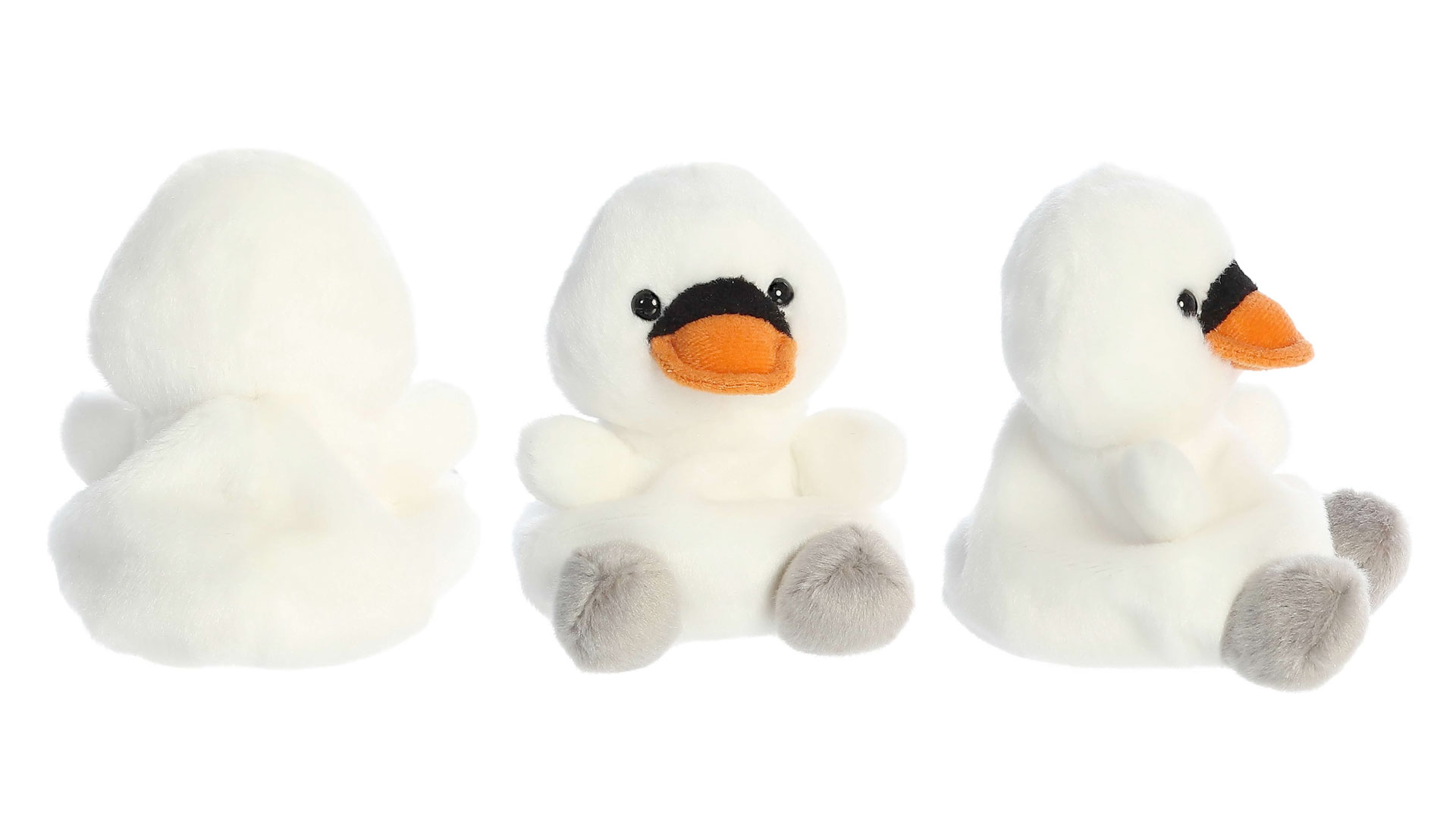 Três visualizações dos lados de uma boneca de cisne de bebê macia