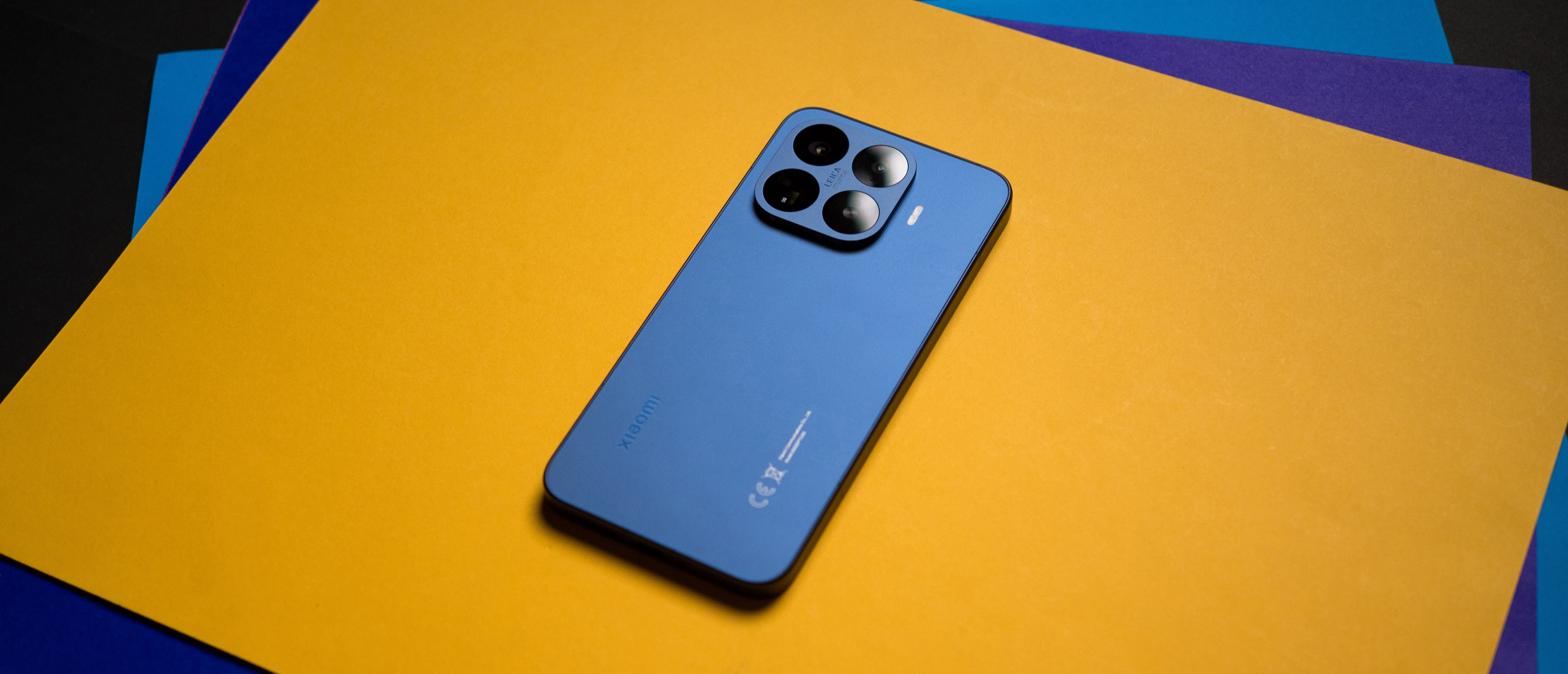 Xiaomi 17T Pro rear view against a colorful craft sheet highlighting the design