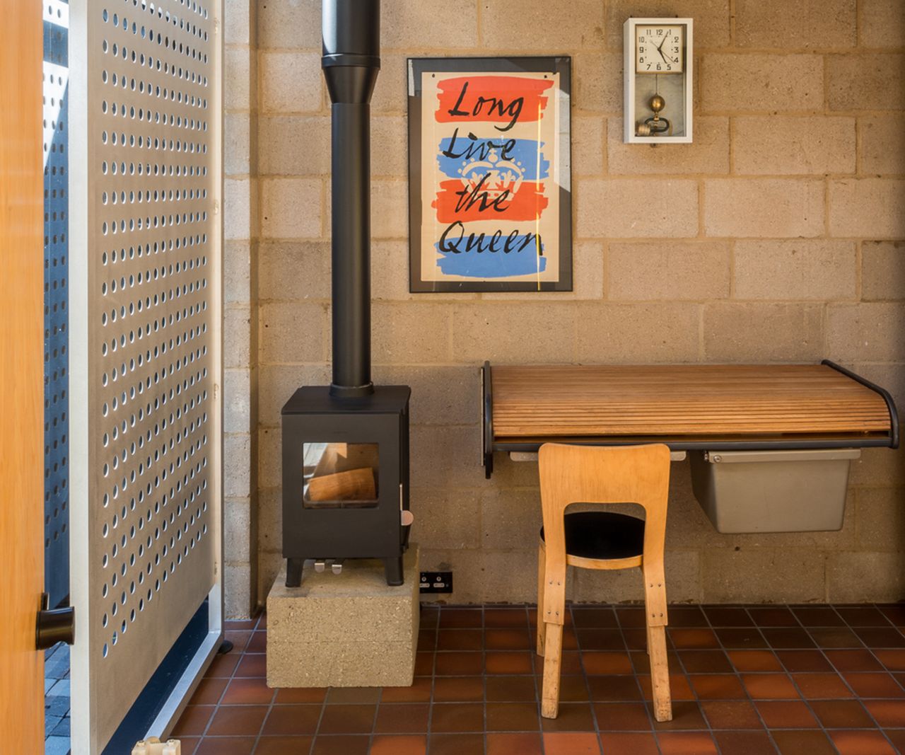Before shots of 1 970s style single storey london house before a renovation and first floor extension. There is a lack of natural light but pops of bright yellow interiors a terracotta tiled floor and built in log burner