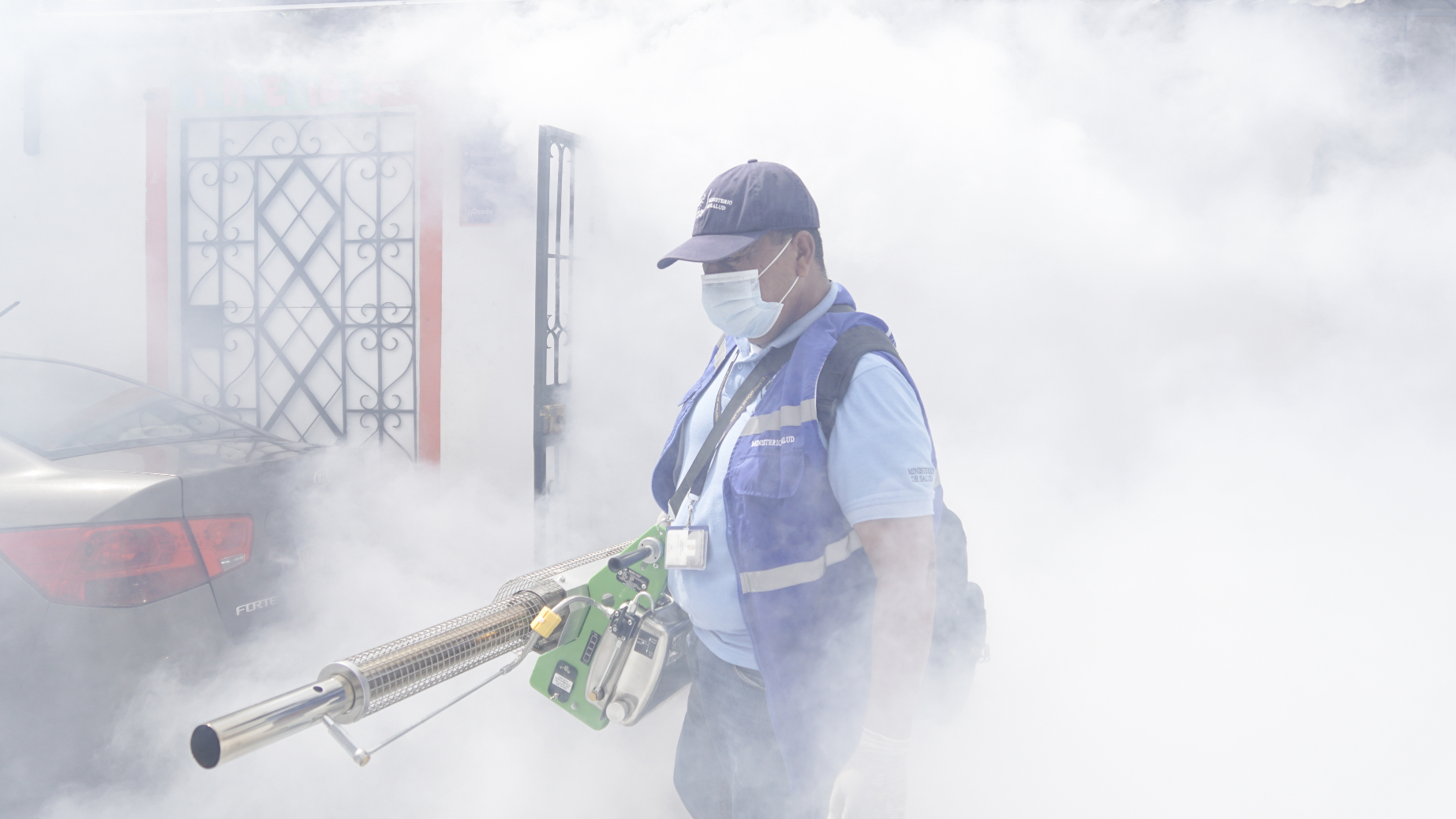 A municipal worker sprays chemicals against mosquitoes that spread illnesses, including zika virus