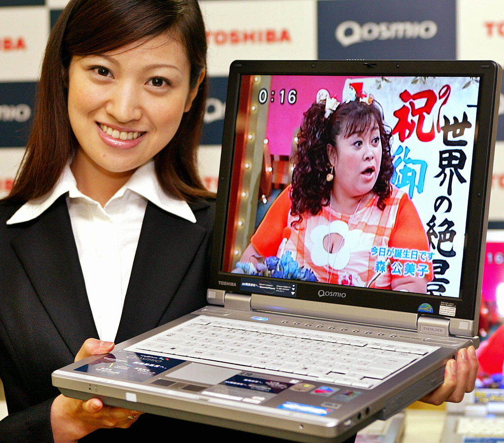 A salesperson advertising the newly-released Toshiba Qosmio in 2005.