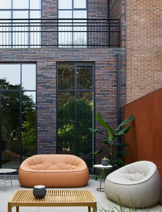 modern garden with curved sofas and chairs