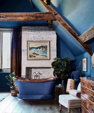 Blue bathroom with freestanding bath in copper and blue