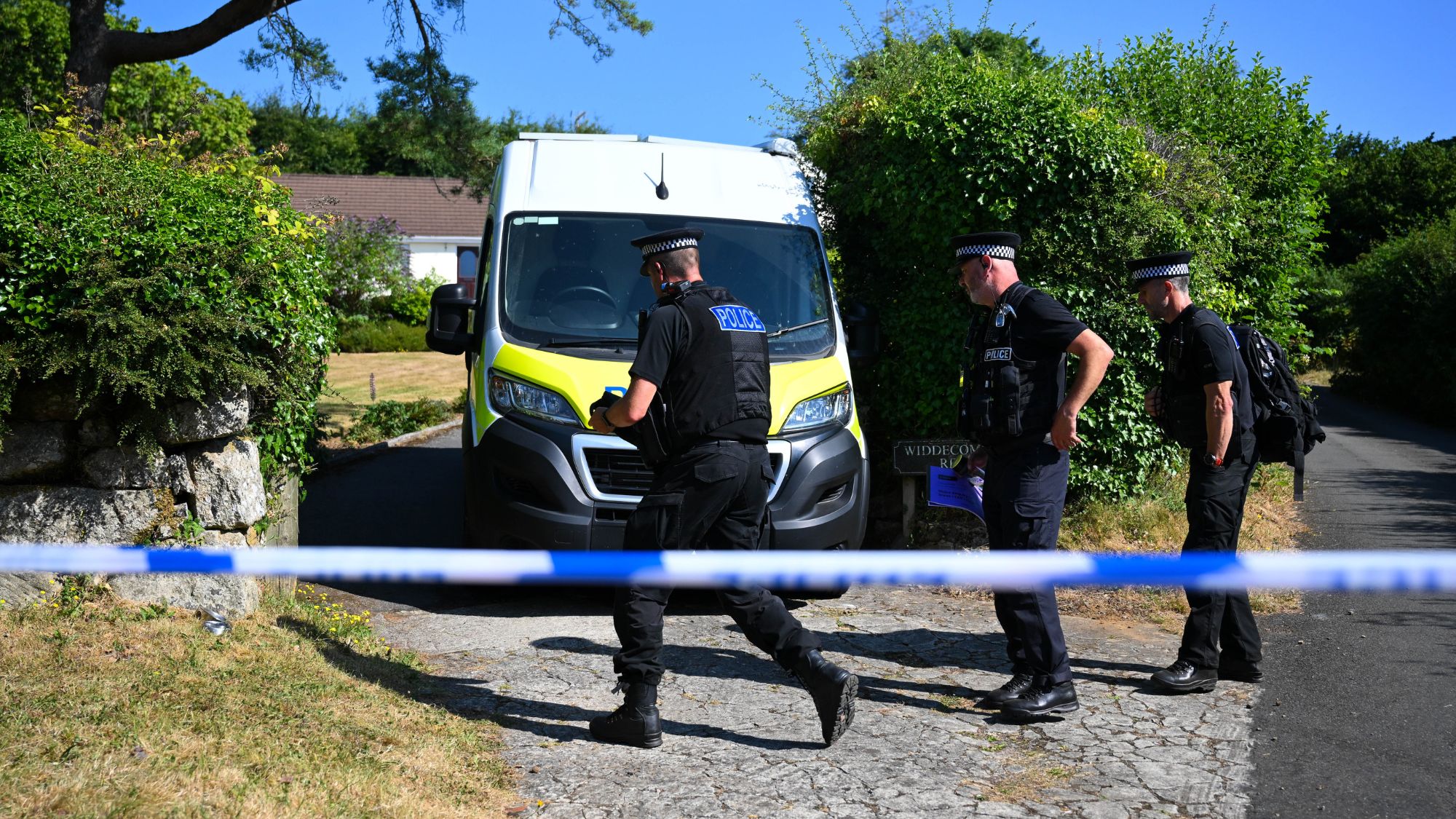 Police officers outside the house of Ann Widdecombe in Haytor in Dartmoor, UK