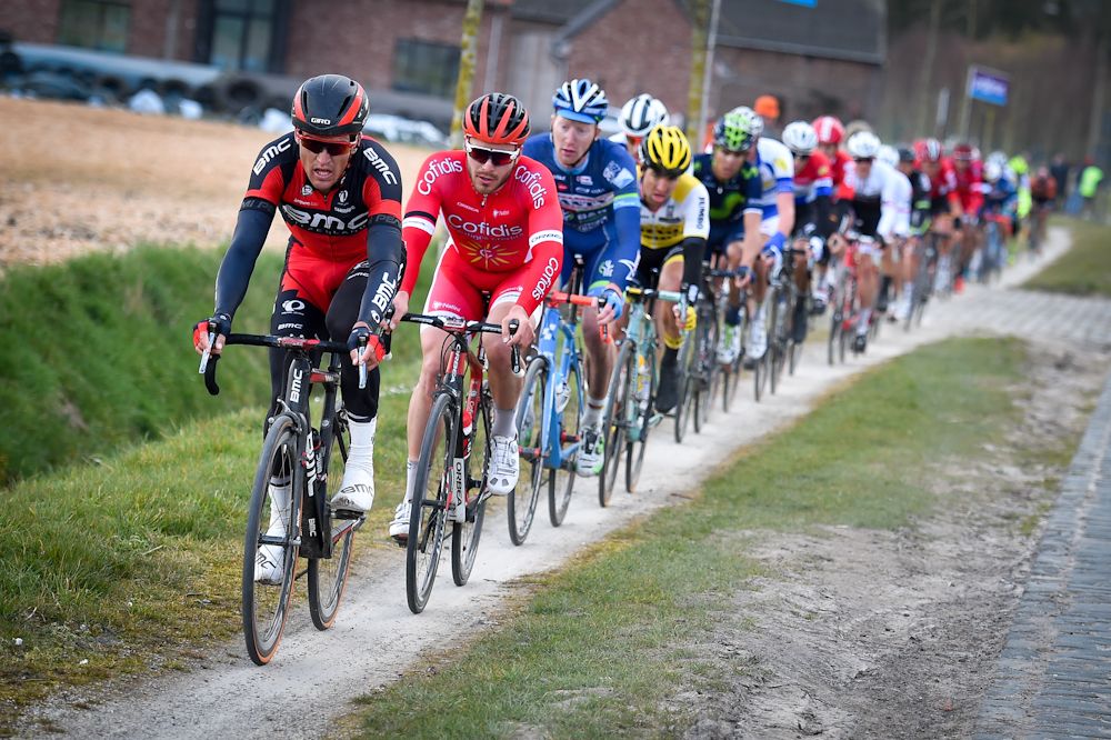 Greg Van Avermaet of BMC Racing team, French cyclist Florian Senechal of team Cofidis pedal the Varenstraat cobblestoned section during the 71st edition of the 'Dwars Door Vlaanderen'